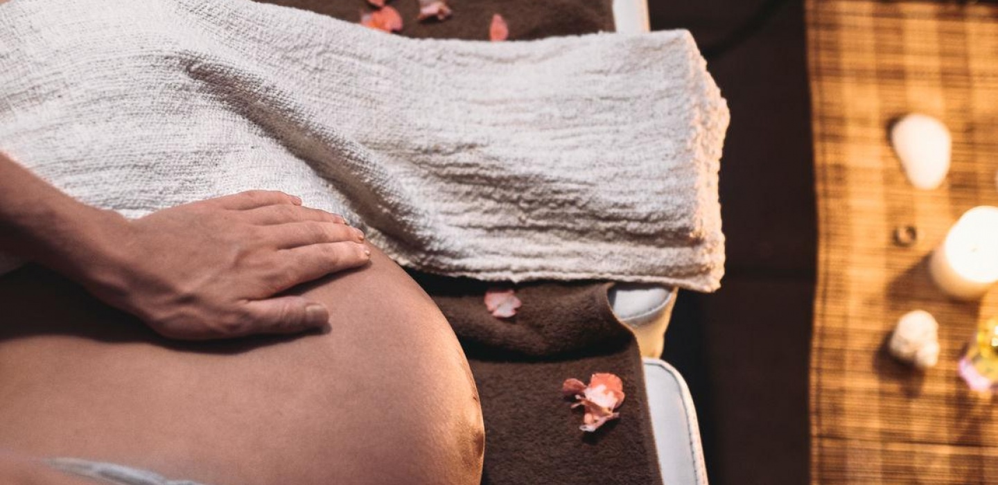 A mum to be is having a pregnancy massage in Cloud Twelve