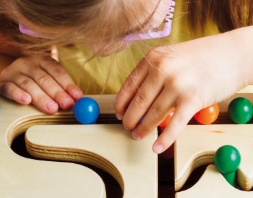 A child is playing at Cloud Twelve's play zone