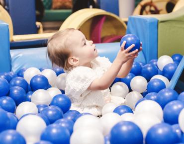 A child is playing at Cloud Twelve's play zone