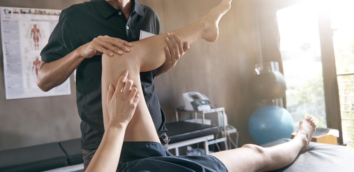 An Osteopath examining a patient in the Clouid Twelve osteopathy clinic