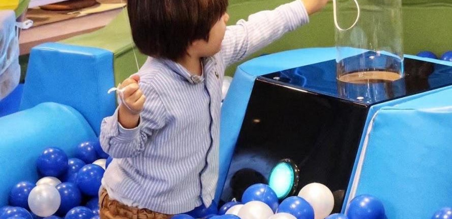 A child is playing at Cloud Twelve's play zone