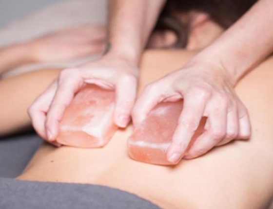 A lady is having a body and scrub treatment in London's cloud twelve luxury spa.