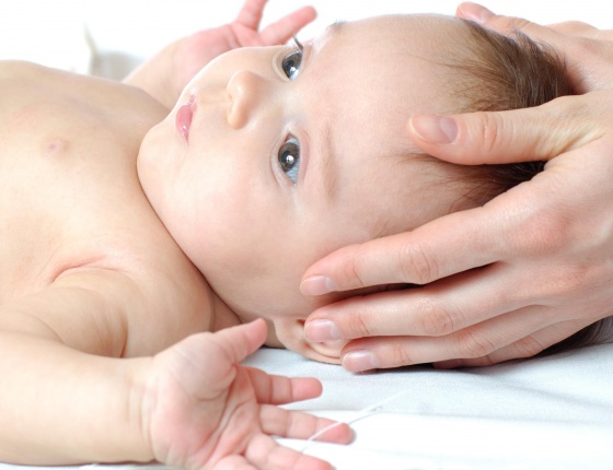 Baby having craniosacral therapy in London