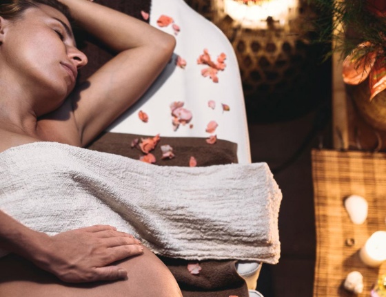 A pregnant lady is having a massage in Notting Hill London