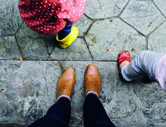 Children playing and are supervised by a parent