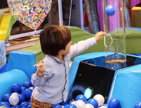 A child is playing at Cloud Twelve's play zone